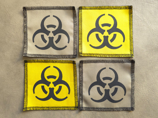 Handmade screen printed biohazard symbol patch, front view showing detailed ink design on fabric