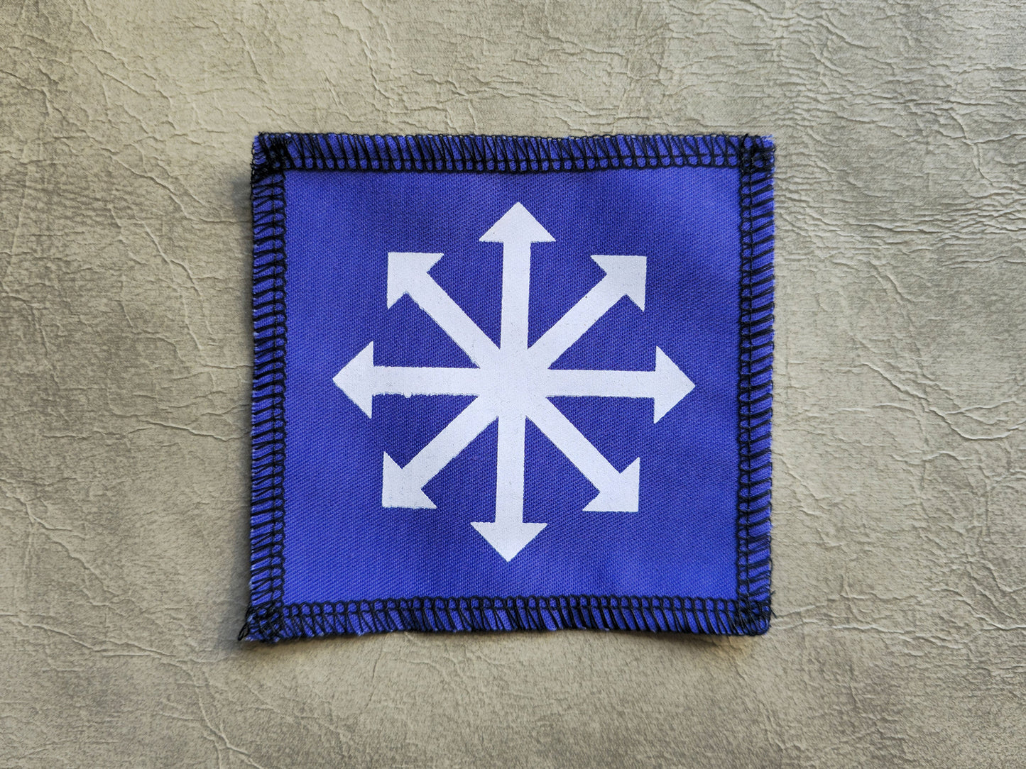 Purple handmade screen printed chaos symbol patch with detailed screen print design