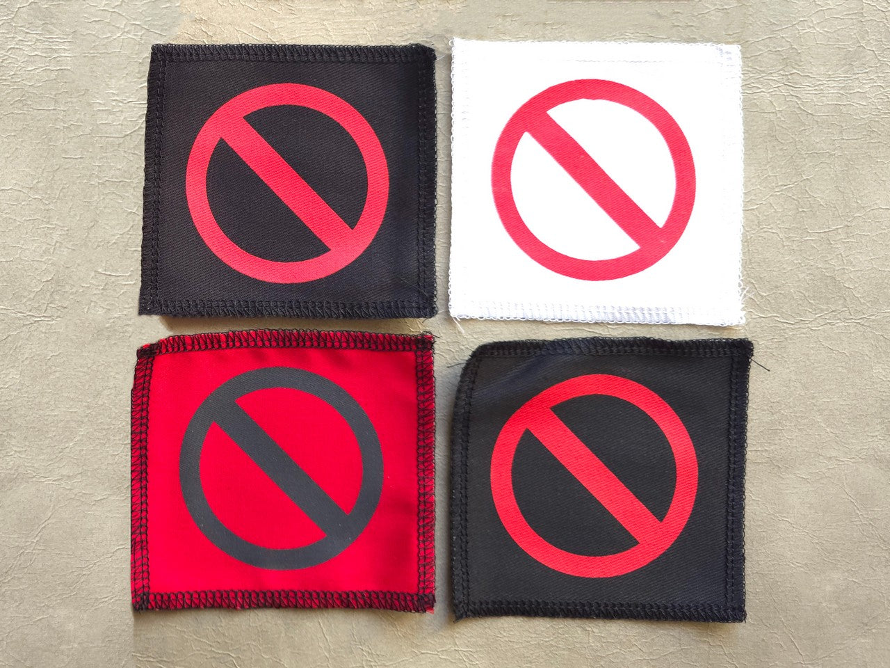 Handmade screen printed do not symbol patch, front view showing detailed ink design on fabric