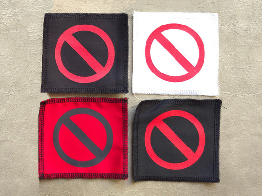 Handmade screen printed do not symbol patch, front view showing detailed ink design on fabric