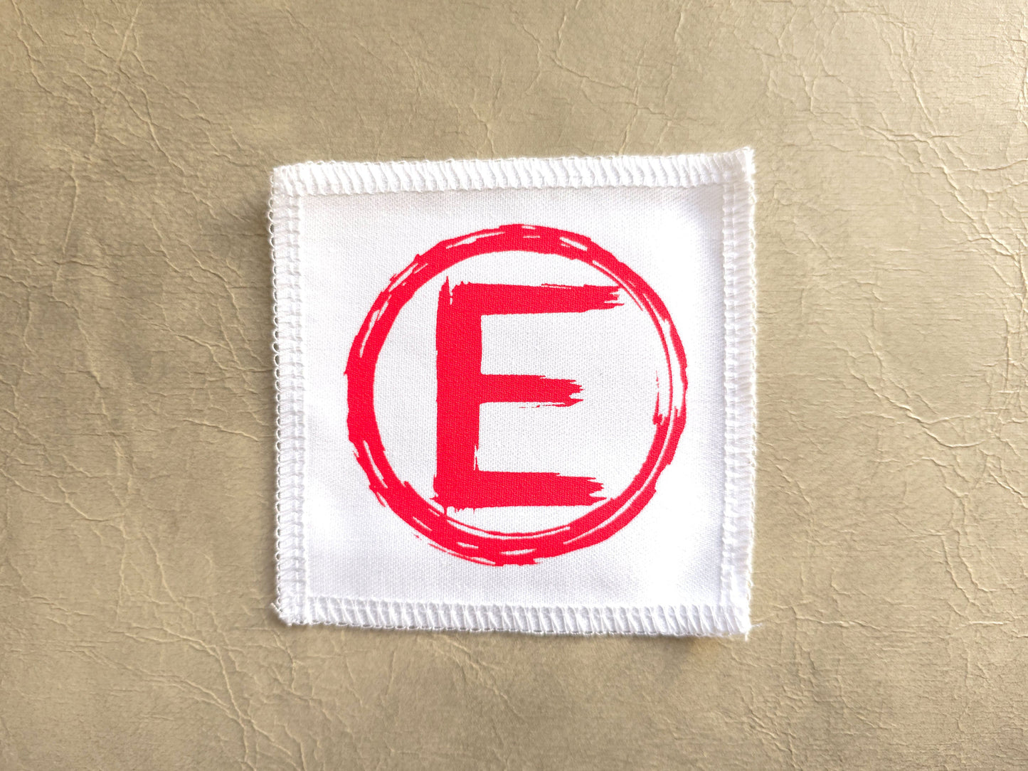 handmade screen printed White square patch with red 'E' -equality symbol