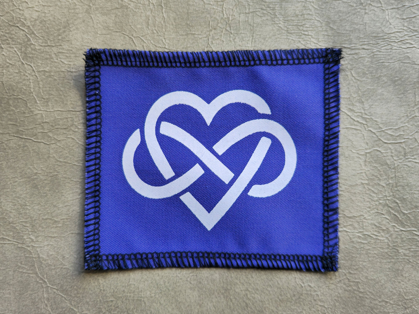 Purple handmade screen printed forever love symbol patch with detailed screen print design