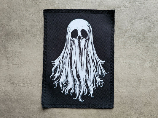Front view of a handmade screen printed ghost patch with bold ink design on durable fabric backing