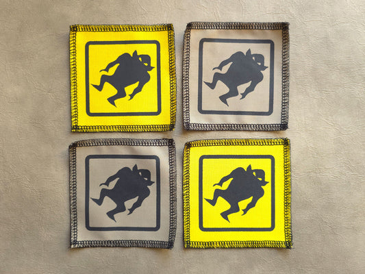Handmade screen printed monster symbol patch, front view showing detailed ink design on fabric