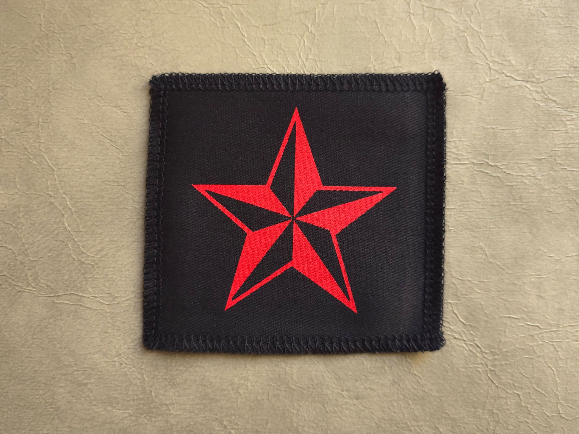 handmade screen printed Black patch with a red star - nautical star