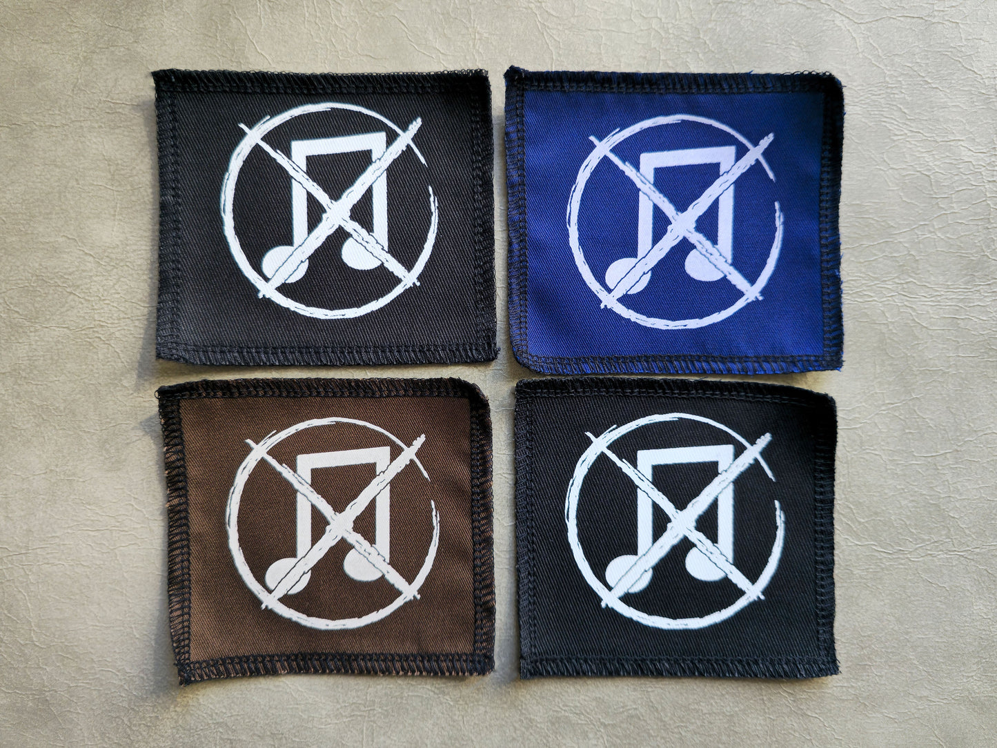Handmade screen printed noise not music symbol patch, front view showing detailed ink design on fabric