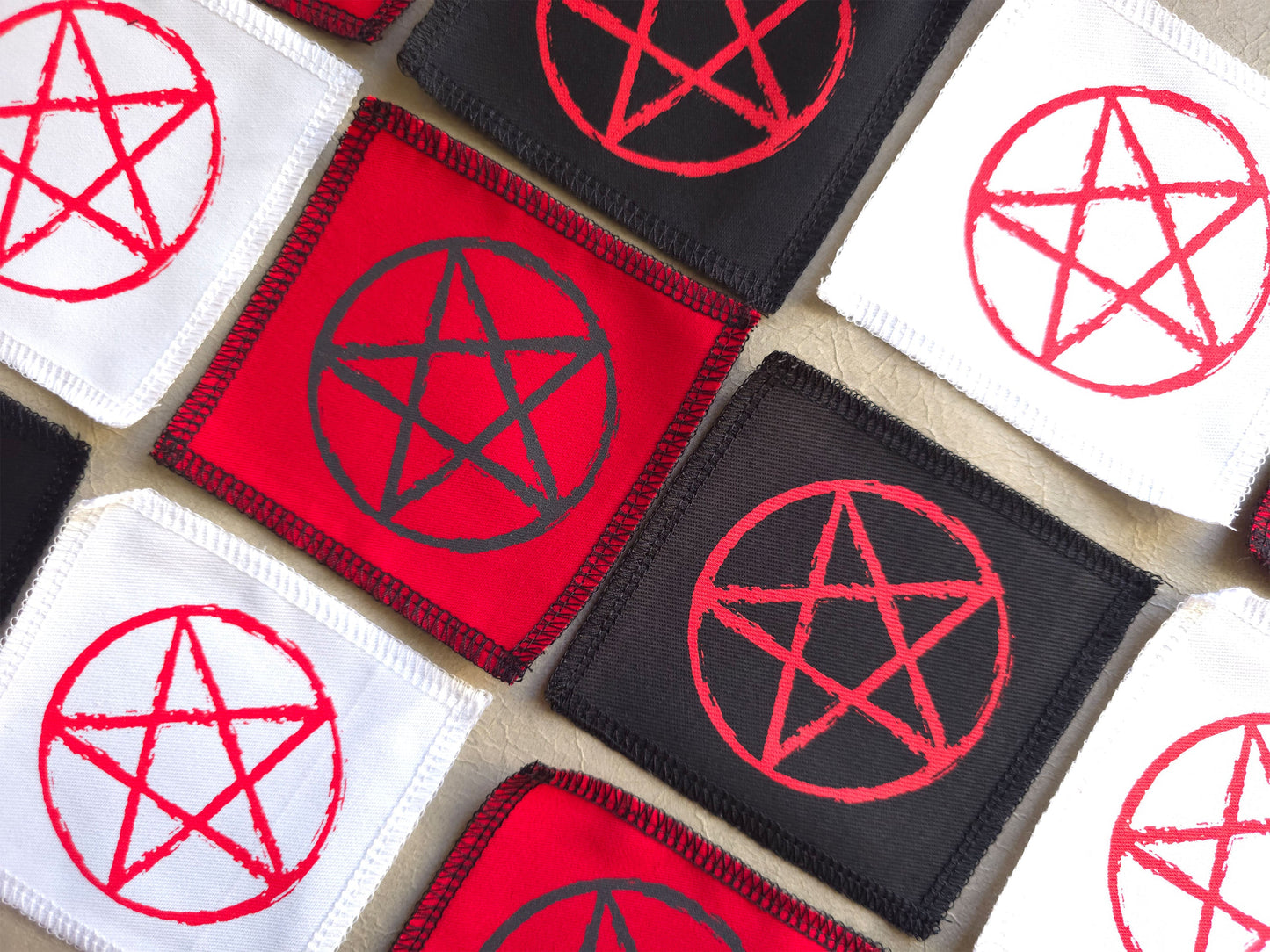 Collection of pentagram patches in red and black 