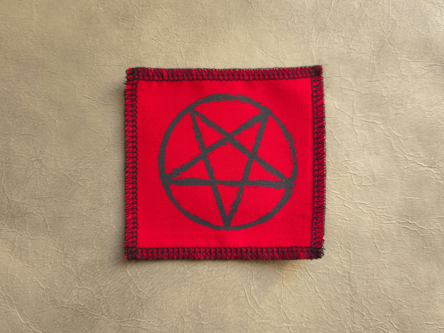handmade screen printed Red square patch with black pentagram symbol 