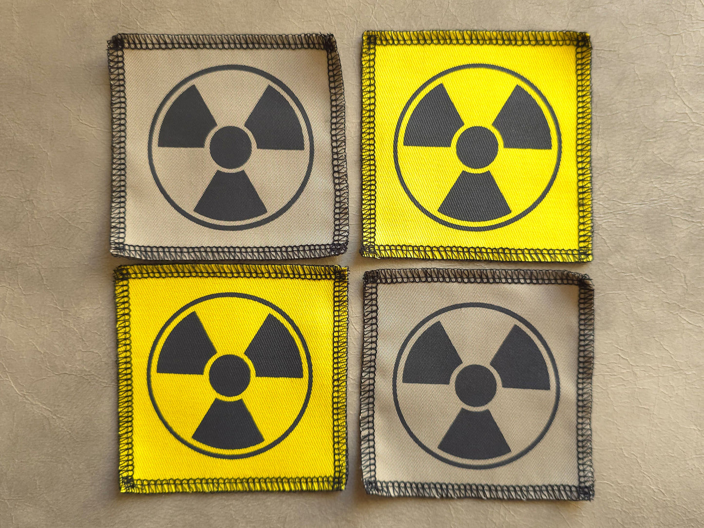 Handmade screen printed radioactive symbol patch, front view showing detailed ink design on fabric