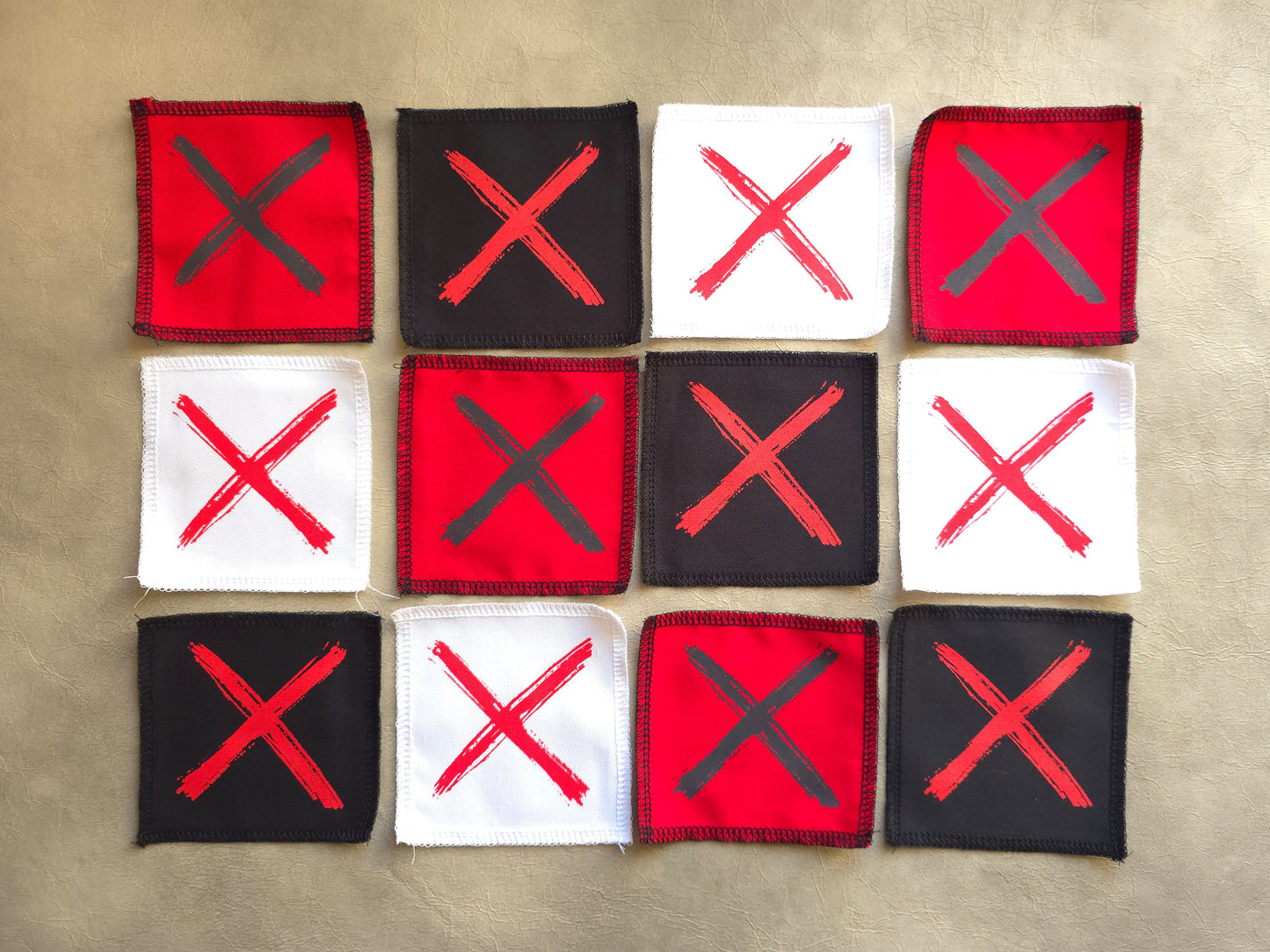 Handmade screen printed x symbol patch available in multiple color options